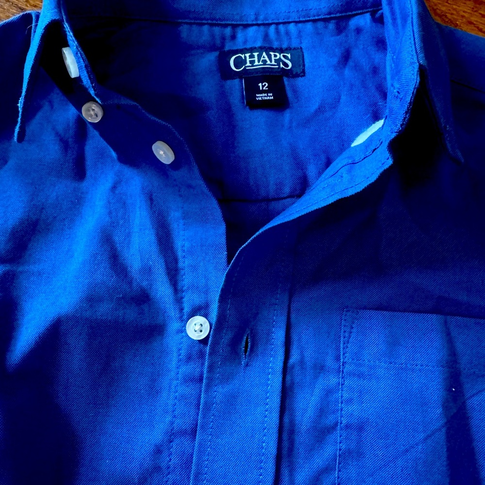 Brand new with tags. Smoke free, pet free home dress shirt, size 12 boys.